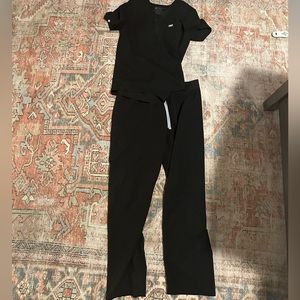 Figs scrubs. Top and bottom. Both size large. Color is black
